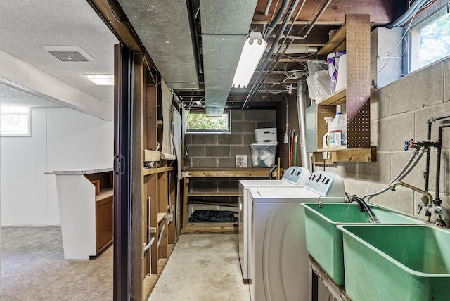 6925 Colorado Ave N, Brooklyn Park, MN 55429 - below grade area featuring washing machine and clothes dryer and a sink