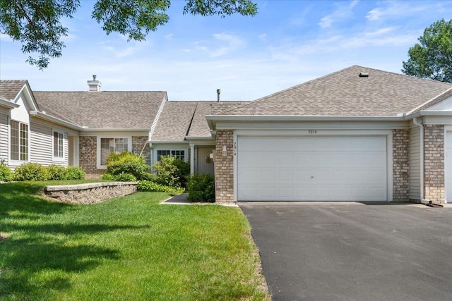7514 Ojibway Park Rd, Woodbury, MN 55125 - view of front of home featuring asphalt driveway, a front yard, a shingled roof, a garage, and a chimney