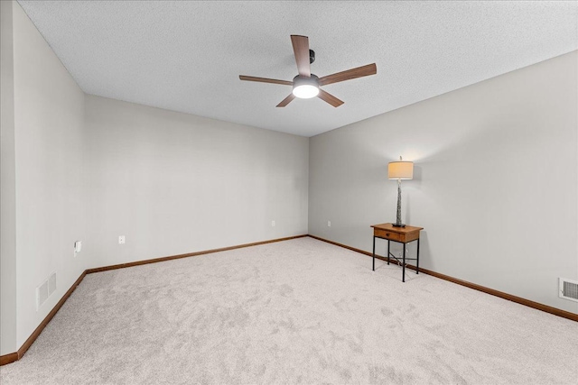 7514 Ojibway Park Rd, Woodbury, MN 55125 - carpeted spare room with a ceiling fan and a textured ceiling
