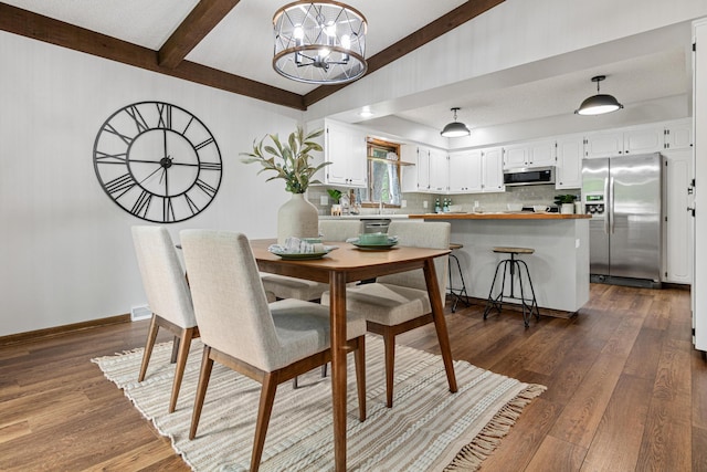 7401 River Shore Ln, Champlin, MN 55316 - dining area with a chandelier and dark wood-style floors