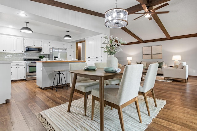 7401 River Shore Ln, Champlin, MN 55316 - dining room with beam ceiling, a chandelier, dark wood-style floors, ceiling fan, and high vaulted ceiling