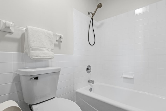 7401 River Shore Ln, Champlin, MN 55316 - full bath with tile walls, tub / shower combination, and wainscoting