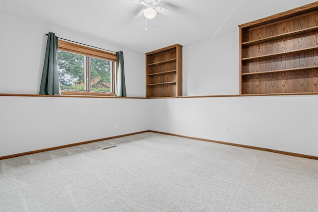 7401 River Shore Ln, Champlin, MN 55316 - carpeted spare room featuring ceiling fan and baseboards