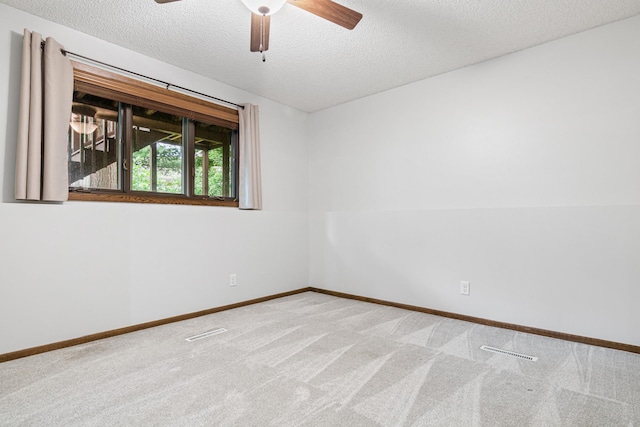 7401 River Shore Ln, Champlin, MN 55316 - empty room featuring carpet floors, a textured ceiling, and a ceiling fan
