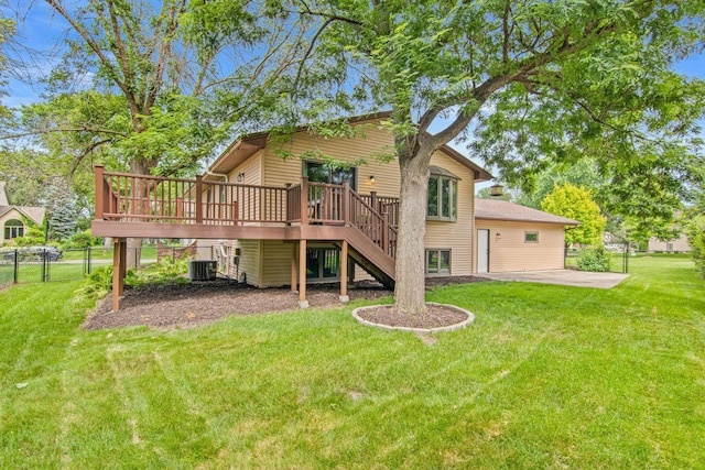 7401 River Shore Ln, Champlin, MN 55316 - rear view of house with stairs, a wooden deck, and a patio area