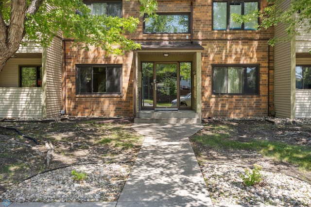 3237 17th Ave S Unit 101, Fargo, ND 58103 - doorway to property featuring brick siding