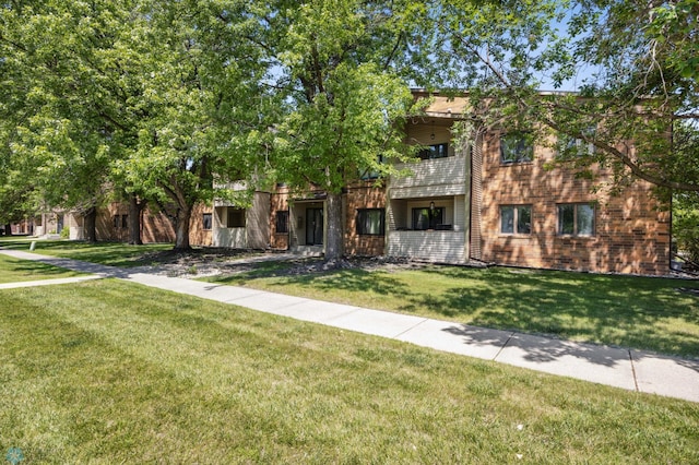 3237 17th Ave S Unit 101, Fargo, ND 58103 - view of front of home with a front lawn and a balcony