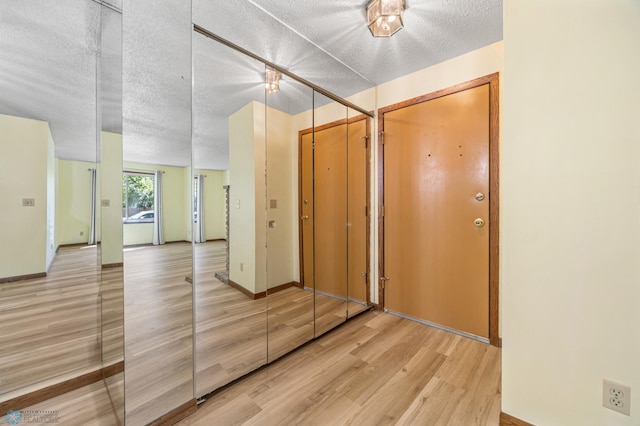 3237 17th Ave S Unit 101, Fargo, ND 58103 - foyer with wood finished floors and a textured ceiling