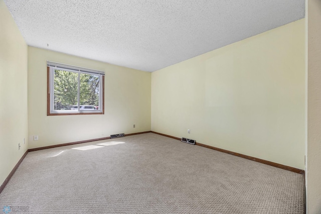 3237 17th Ave S Unit 101, Fargo, ND 58103 - unfurnished room with carpet floors and a textured ceiling