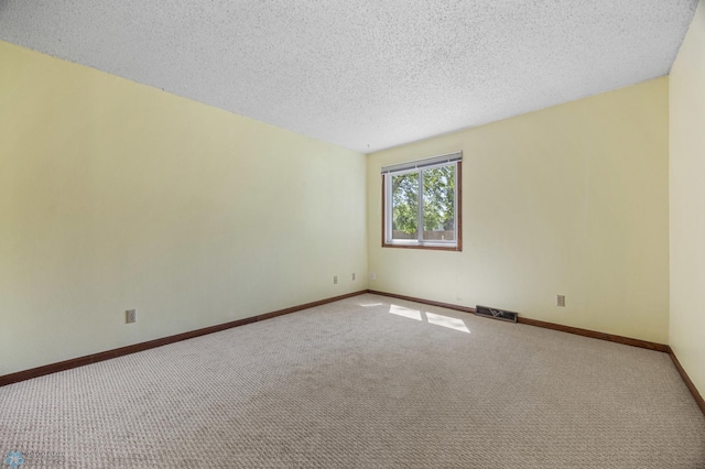 3237 17th Ave S Unit 101, Fargo, ND 58103 - carpeted empty room with baseboards and a textured ceiling