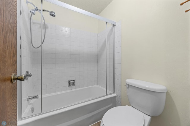 3237 17th Ave S Unit 101, Fargo, ND 58103 - full bathroom featuring toilet and bath / shower combo with glass door