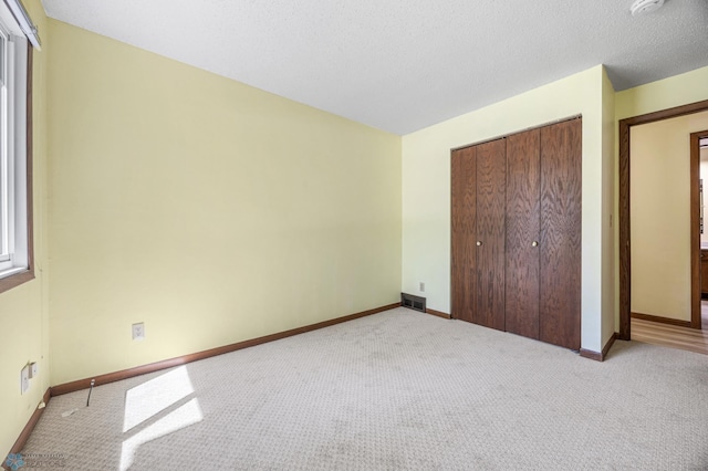 3237 17th Ave S Unit 101, Fargo, ND 58103 - unfurnished bedroom with light colored carpet and a closet
