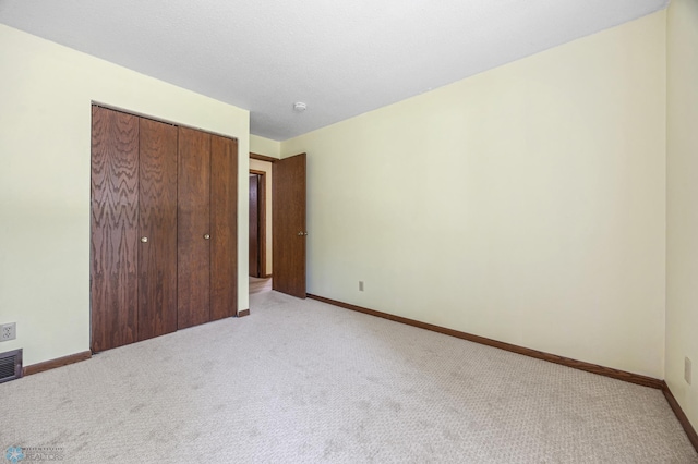 3237 17th Ave S Unit 101, Fargo, ND 58103 - unfurnished bedroom featuring light carpet and a closet