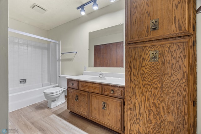 3237 17th Ave S Unit 101, Fargo, ND 58103 - full bathroom featuring vanity, wood finished floors, and shower / washtub combination
