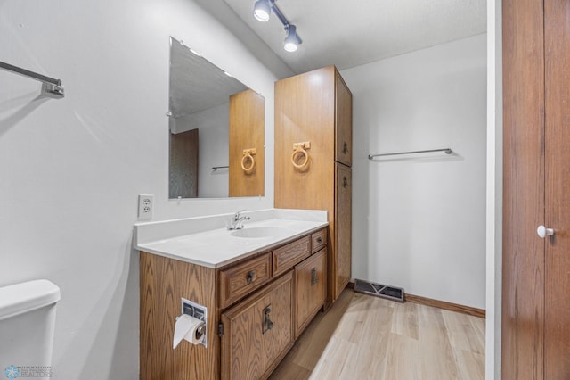 3237 17th Ave S Unit 101, Fargo, ND 58103 - bathroom with vanity and wood finished floors