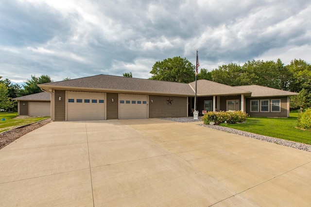 15212 667th St, Wabasha, MN 55981 - ranch-style house with a garage, concrete driveway, and a front lawn
