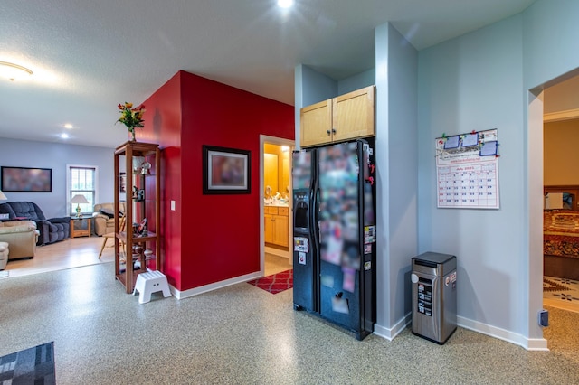 15212 667th St, Wabasha, MN 55981 - kitchen featuring black fridge, light brown cabinetry, and open floor plan