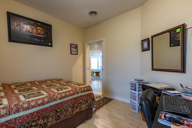 15212 667th St, Wabasha, MN 55981 - bedroom featuring light wood-type flooring and an office area