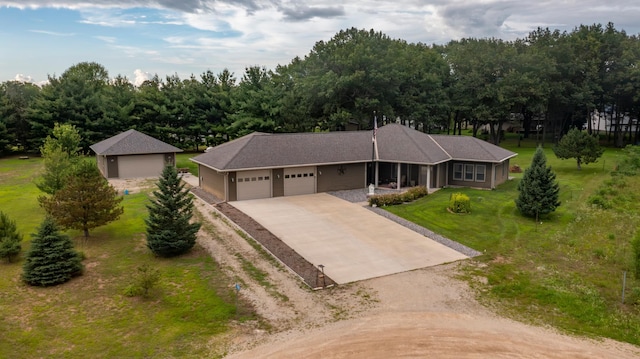 15212 667th St, Wabasha, MN 55981 - view of front of home with dirt driveway, an attached garage, and a front yard