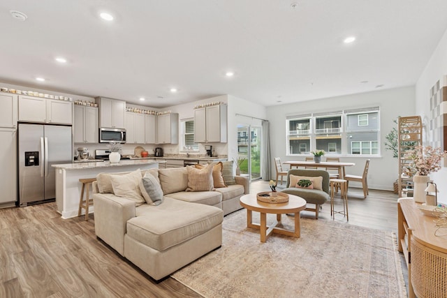 11121 Balsam Pointe Trl, Dayton, MN 55327 - living area featuring light wood-type flooring and recessed lighting