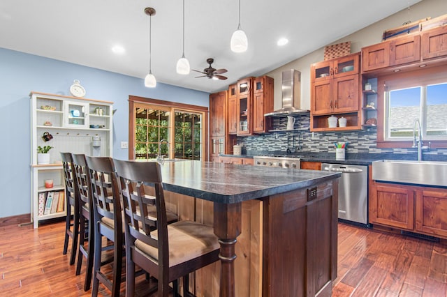 1962 72 1/2 St, Centerville, MN 55038 - kitchen featuring stainless steel dishwasher, wall chimney exhaust hood, open shelves, dark wood finished floors, and recessed lighting