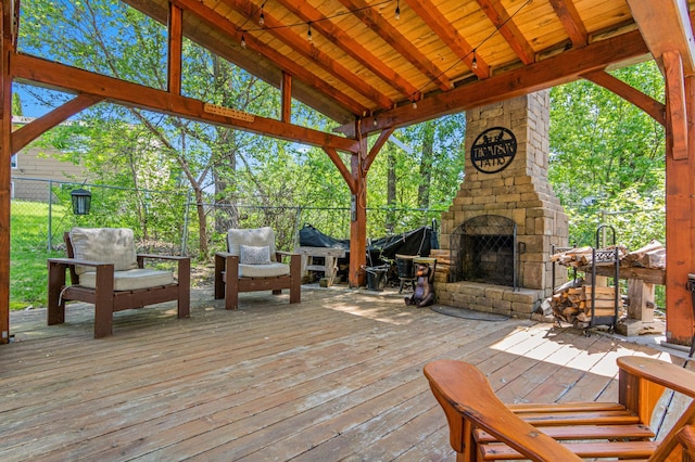 1962 72 1/2 St, Centerville, MN 55038 - wooden terrace featuring an outdoor stone fireplace
