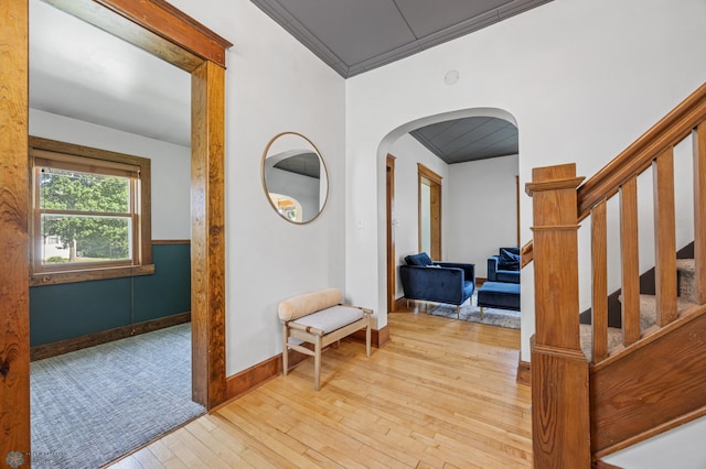 726 Oak St N, Fargo, ND 58102 - corridor with arched walkways, hardwood / wood-style floors, crown molding, and stairway