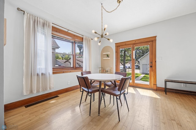 726 Oak St N, Fargo, ND 58102 - dining room with a chandelier and wood-type flooring