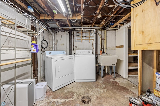726 Oak St N, Fargo, ND 58102 - unfinished below grade area with washer and dryer and a sink