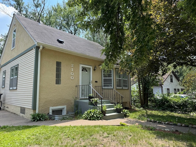 2100 Nortonia Ave, Saint Paul, MN 55119 - bungalow with stucco siding and a shingled roof