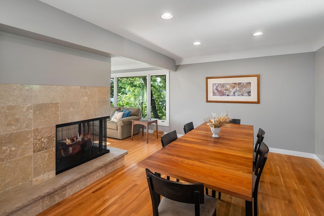 4832 Longford Rd, Mound, MN 55364 - dining space featuring wood finished floors, recessed lighting, and a multi sided fireplace