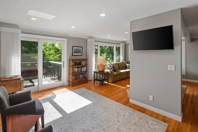 4832 Longford Rd, Mound, MN 55364 - living room featuring healthy amount of natural light, wood finished floors, and recessed lighting