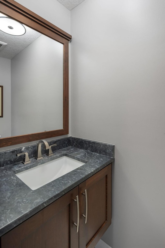 4832 Longford Rd, Mound, MN 55364 - bathroom with a textured ceiling and vanity