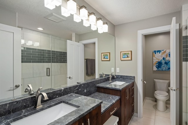 4832 Longford Rd, Mound, MN 55364 - bathroom with double vanity, a textured ceiling, tile patterned floors, and a stall shower