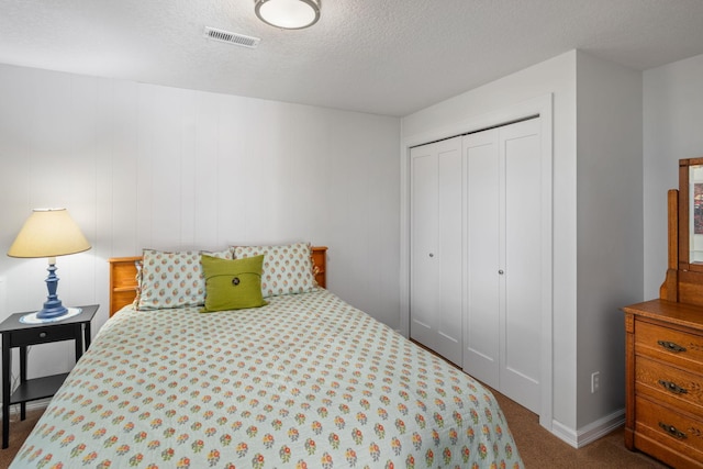 4832 Longford Rd, Mound, MN 55364 - bedroom featuring dark colored carpet, a closet, and a textured ceiling