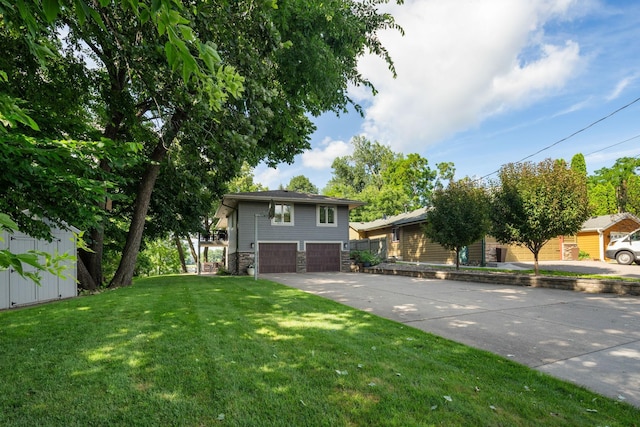 4832 Longford Rd, Mound, MN 55364 - view of front of property with stone siding, a garage, concrete driveway, and a front yard