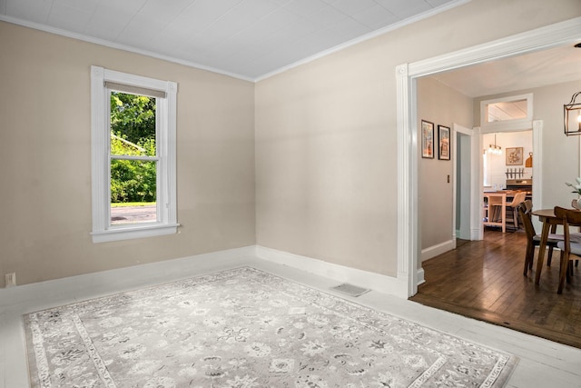 823 Owens St N, Stillwater, MN 55082 - empty room with ornamental molding, wood-type flooring, and a chandelier