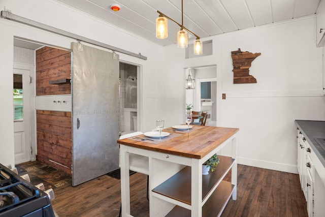 823 Owens St N, Stillwater, MN 55082 - kitchen featuring dark wood-style flooring, butcher block countertops, white cabinetry, pendant lighting, and wooden ceiling