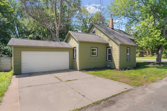 823 Owens St N, Stillwater, MN 55082 - view of front of home featuring a shingled roof, a front lawn, a chimney, a garage, and driveway