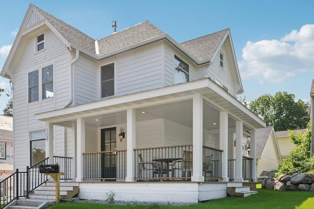 109 Pine St E, Stillwater, MN 55082 - view of front of house with a porch and a shingled roof