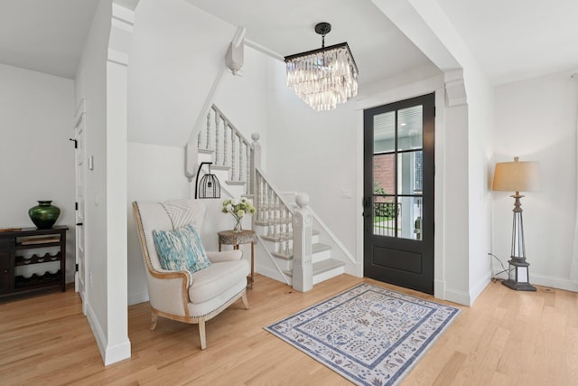 109 Pine St E, Stillwater, MN 55082 - entrance foyer with wood finished floors, a chandelier, and stairs