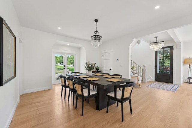 109 Pine St E, Stillwater, MN 55082 - dining space with a chandelier, healthy amount of natural light, light wood-style floors, stairway, and recessed lighting