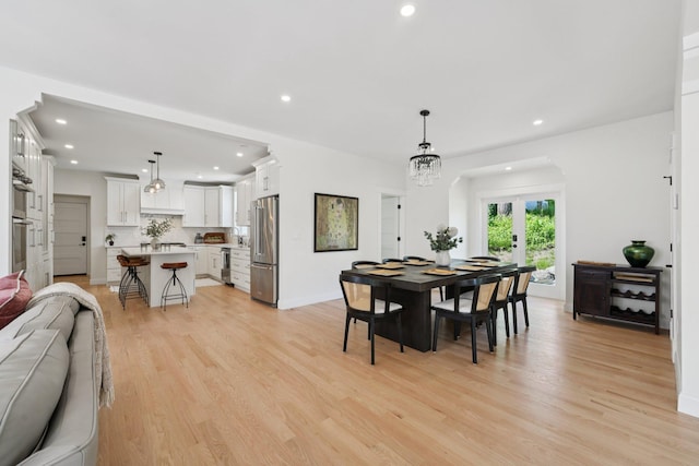 109 Pine St E, Stillwater, MN 55082 - dining space featuring light wood finished floors and recessed lighting