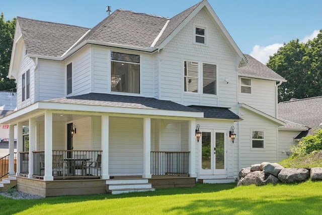 109 Pine St E, Stillwater, MN 55082 - rear view of house with a shingled roof, covered porch, and a yard