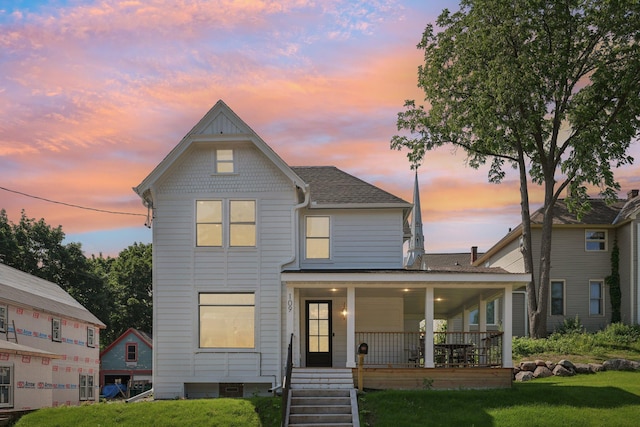 109 Pine St E, Stillwater, MN 55082 - view of front of home featuring a porch, a lawn, and roof with shingles