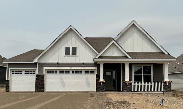 14516 111th Ave E, Dayton, MN 55369 - craftsman inspired home with covered porch, a shingled roof, board and batten siding, driveway, and a garage