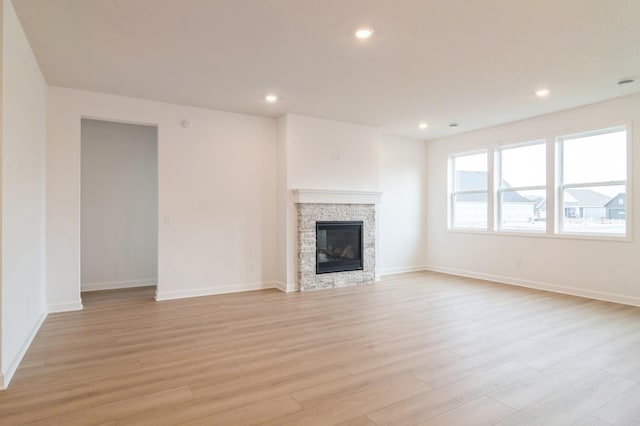 14516 111th Ave E, Dayton, MN 55369 - unfurnished living room featuring light wood-style flooring, recessed lighting, and a fireplace