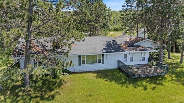 21837 Mishawaka Rd, Grand Rapids, MN 55744 - rear view of property featuring a yard and a shingled roof