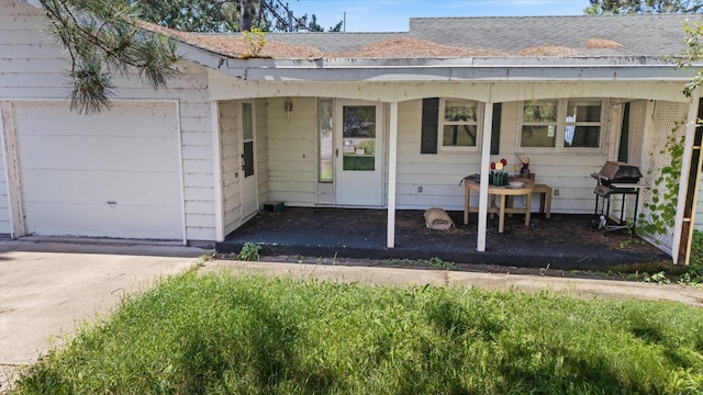 21837 Mishawaka Rd, Grand Rapids, MN 55744 - property entrance with a shingled roof and a garage