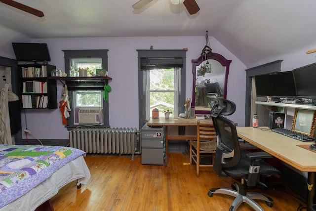 2912 15th Ave S, Minneapolis, MN 55407 - bedroom featuring radiator, a desk, hardwood / wood-style flooring, lofted ceiling, and cooling unit